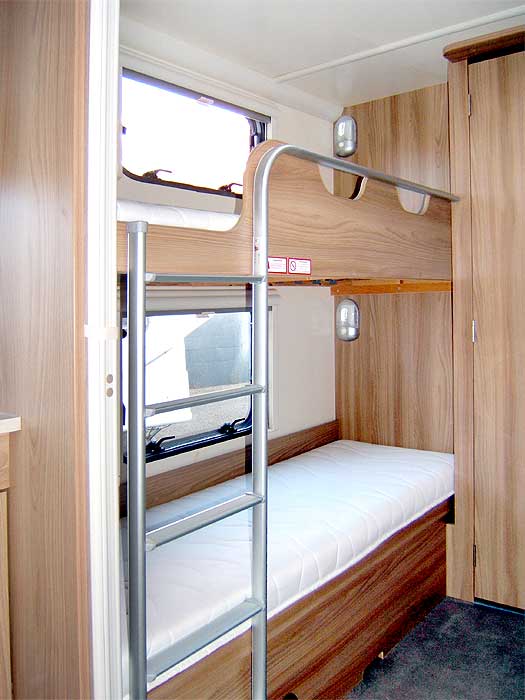 The fixed bunk beds to the rear of the caravan.